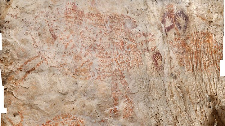Zeichnungen auf Stein aus einer Höhle auf Borneo. Sie sollen mindestens 40.000 Jahre alt sein.