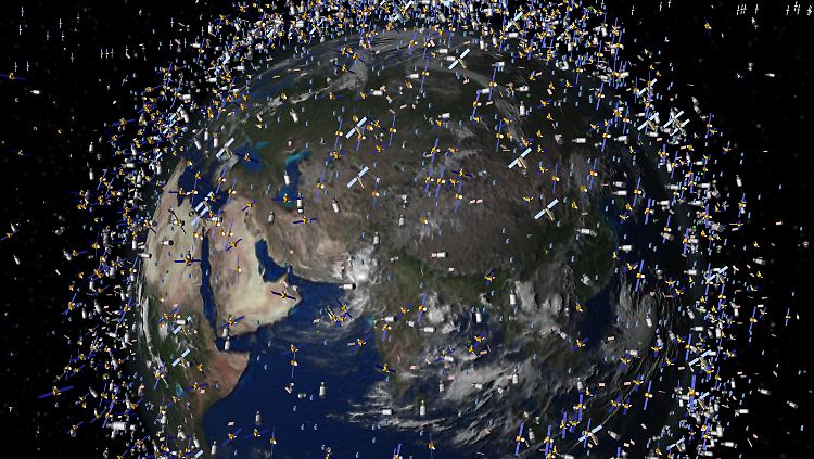 Müll früherer Weltraummissionen, der neben intakten Satelliten um die Erde kreist (Computergrafik der ESA). 
