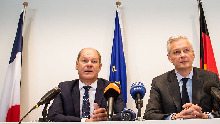 Olaf Scholz und Bruno Le Maire zeigen sich zufrieden.