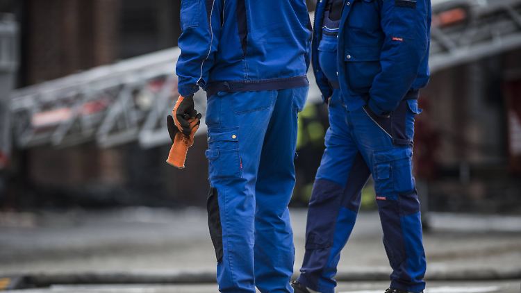 Arbeiter im Blaumann.