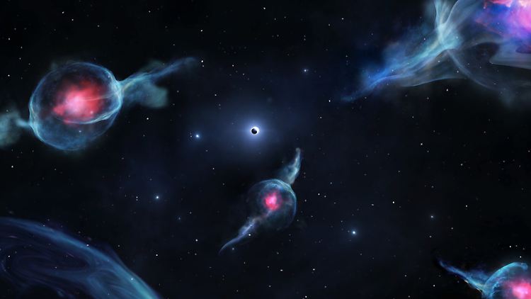 G-Objekte mit den rötlichen Zentren, die das supermassive schwarze Loch im Zentrum unserer Galaxie umkreisen. Das Schwarze Loch wird als dunkle Kugel innerhalb eines weißen Rings (Mitte) dargestellt. (Computergrafik)