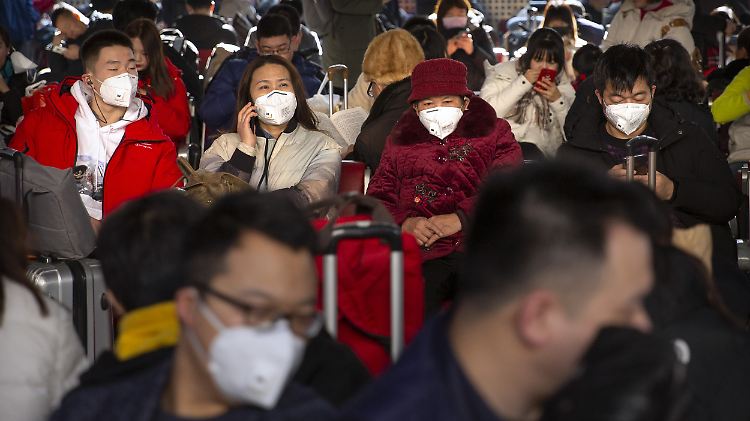 In Peking geht derzeit niemand mehr ohne Mundschutz auf die Straße.