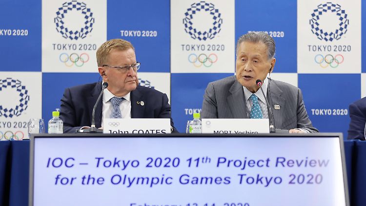 John Coates (links) zerbricht sich den Kopf darüber, wie man die Olympischen Spiele 2021 in Tokio austragen könnte.