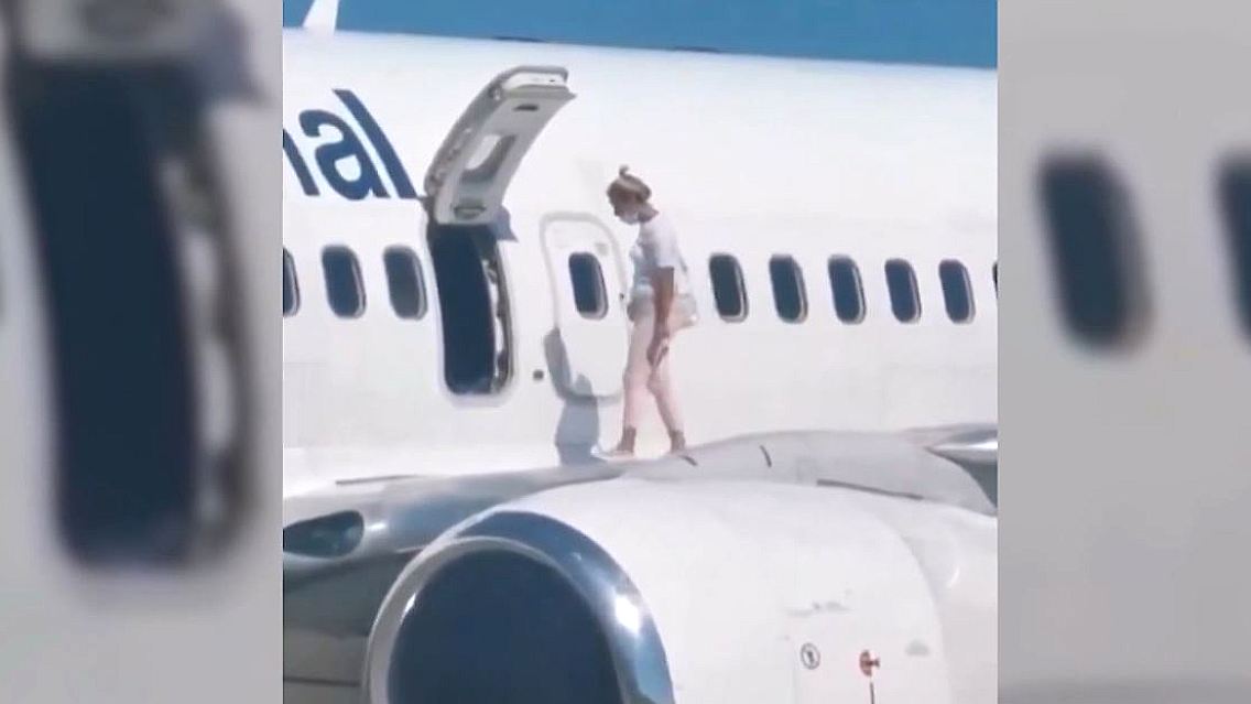 Flugzeug Spaziergang Flügel Passagierin.JPG
