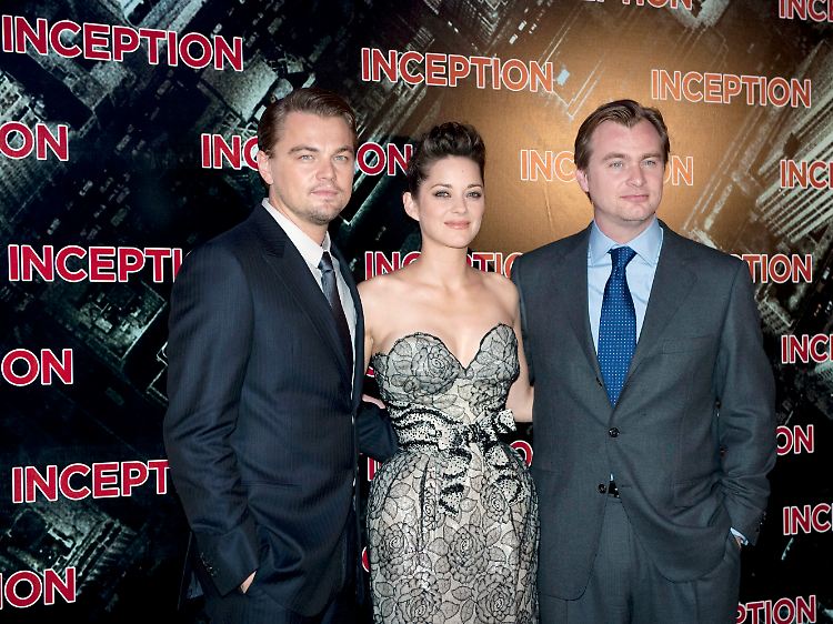 Der "Inception"-Regisseur und seine Stars: Christopher Nolan (r.) mit Marion Cotillard (M) und Leonardo DiCaprio (l.).