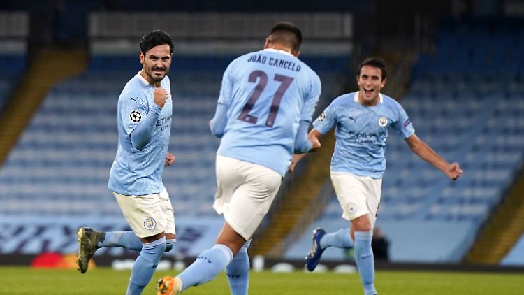 Gegen Porto gelingt Ilkay Gündogan (l.) ein Freistoßtor.