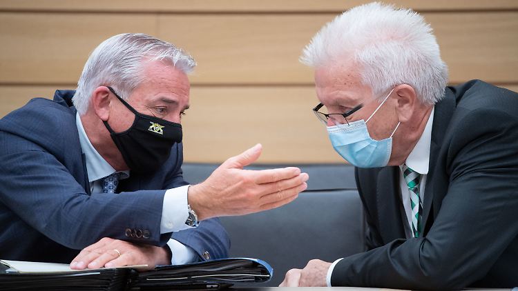 Strobl (mit BW-Regierungschef Kretschmann) bewirbt einen Lockdown.