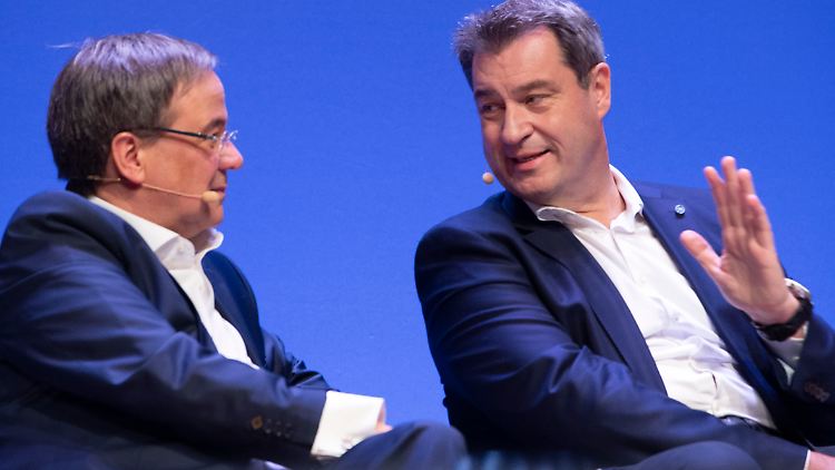 Markus Söder (r.) springt seinem Konkurrenten Armin Laschet in der Diskussion um den "Brücken-Lockdown" zur Seite.