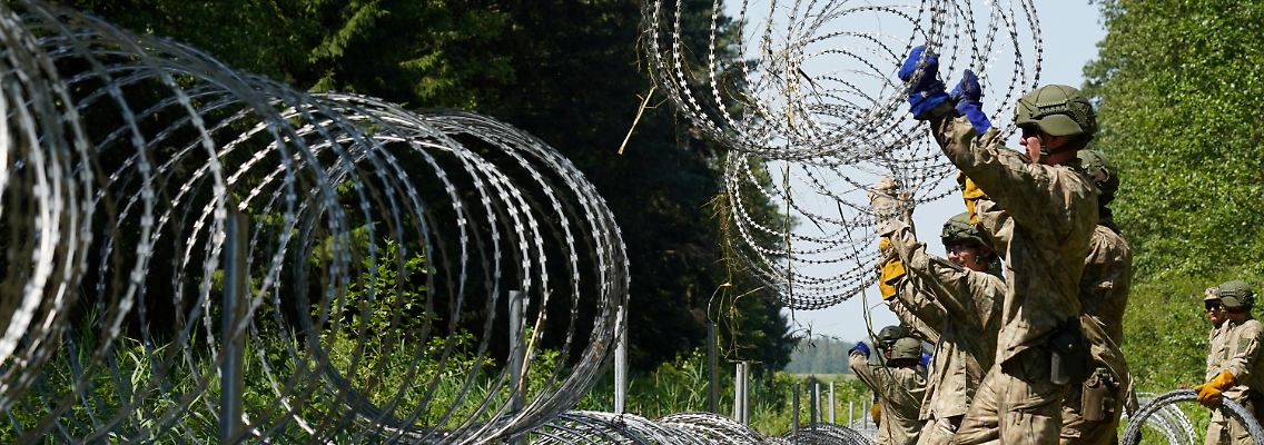 2021-08-04T143751Z_8183750_RC2EYO9KO2I1_RTRMADP_3_BELARUS-POLITICS-LITHUANIA-BORDER.JPG