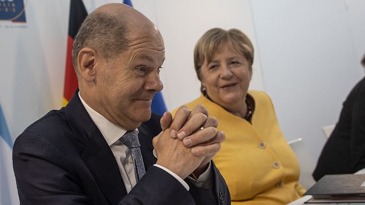 Beim G20-Gipfel treten Merkel und Scholz im Duo auf, beim künftigen Corona-Kurs setzt Scholz auf die Ampel-Beschlüsse. 