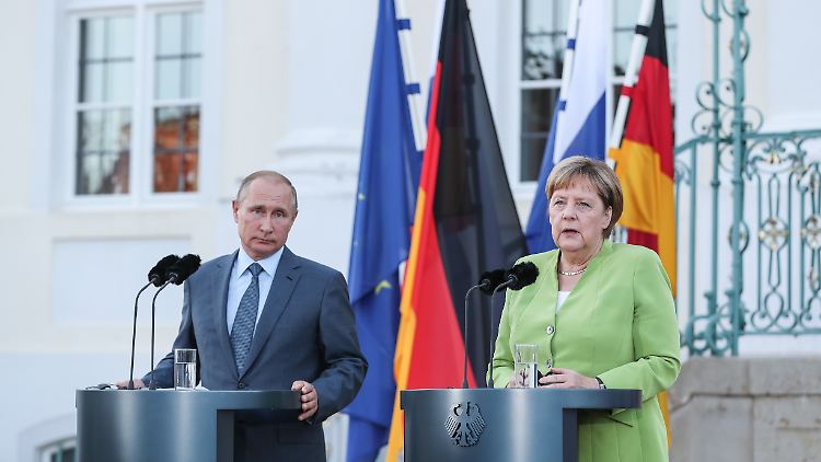 Wladimir Putin und Angela Merkel.
