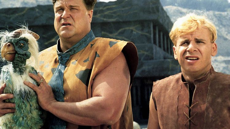 Fred Feuerstein (John Goodman, l.) und Barney Geröllheimer (Rick Moranis).