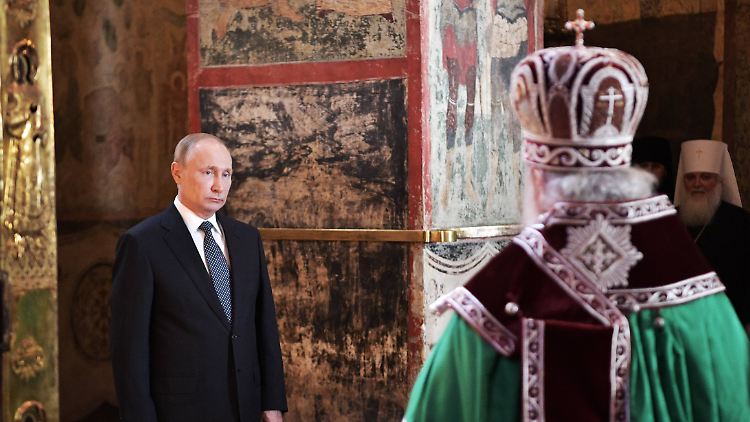 Putin bei einer Messe mit dem russisch-orthodoxen Kirchenoberhaupt Kyrill.