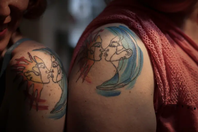 2024-06-03T081242Z-1372684816-RC24T7AVH1M3-RTRMADP-3-ALBANIA-LGBT-FAMILY