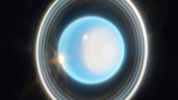 Uranus-Aufnahme des JWST - bei den zwei leuchtenden Flecken soll es sich um Wolken handeln.