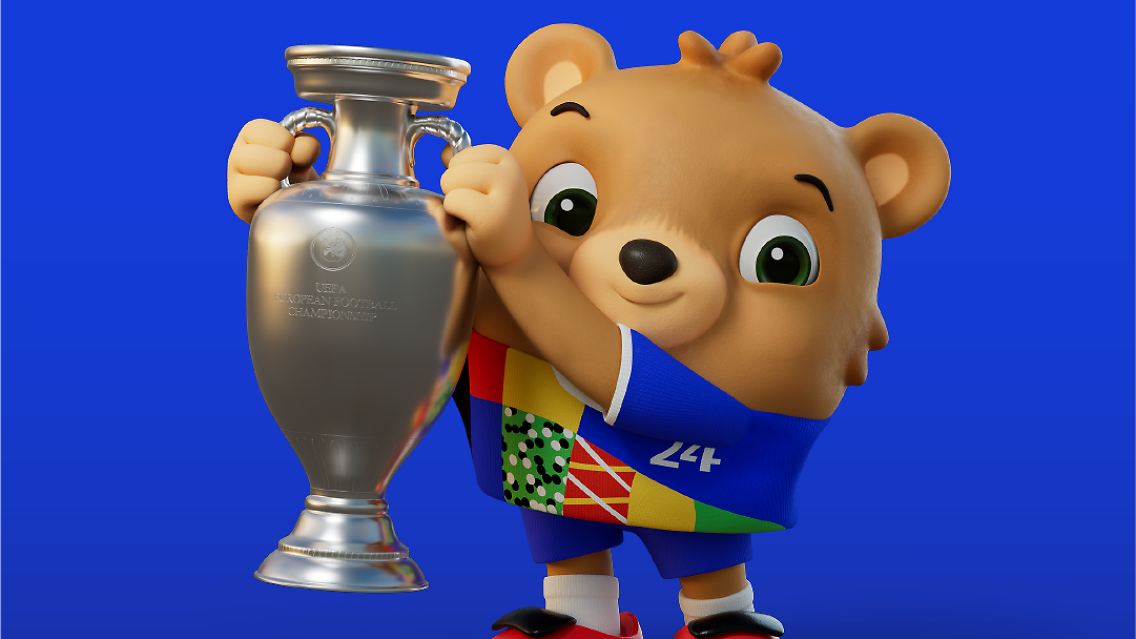 Ein Bär wird das Maskottchen für die EM 2024 in Deutschland sein. Noch ist das Tier namenlos, wie er heißt, sollen die Fans auswählen. Die Veranstalter erklären die Wahl des Bären mit dem Teddybären, …