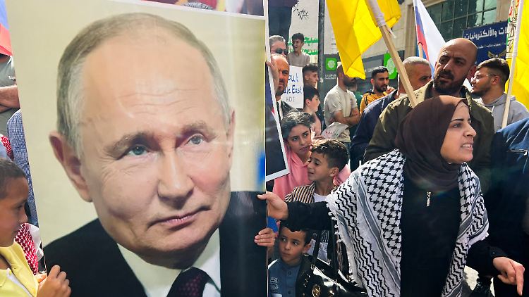 Palästinenser in Hebron gehen mit einem Plakat von Putin auf die Straßen.