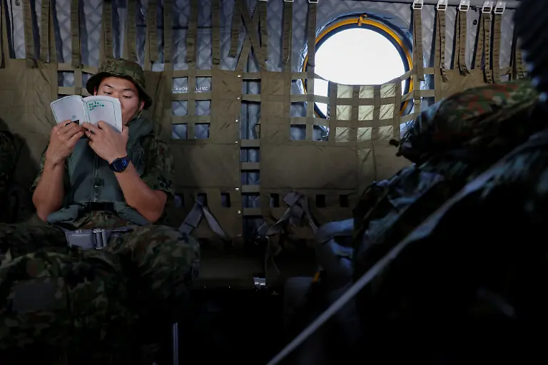 2024-01-10T230745Z-1052301632-RC2HD4A33QR5-RTRMADP-3-JAPAN-DEFENCE-WOMEN