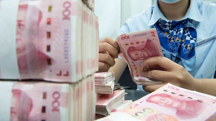 China versucht, den Renminbi zu internationalisieren, sagen Analysten.