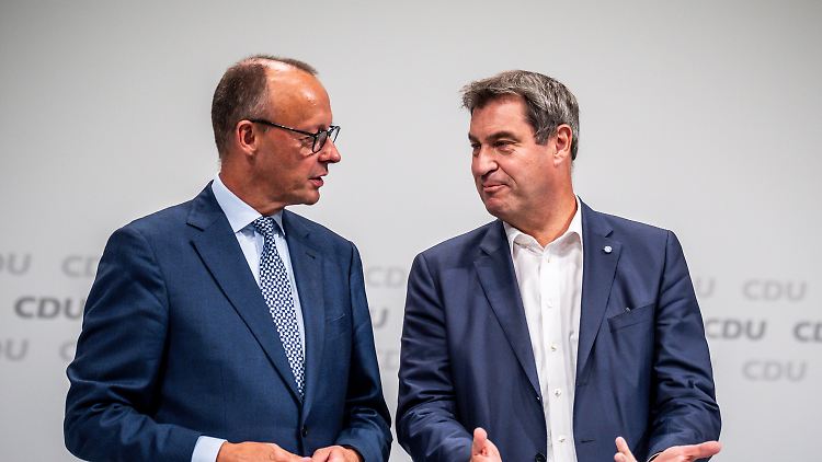 Söder (r.) stützt Merz bei der K-Frage.