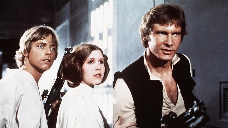 Harrison Ford (rechts) als Han Solo an der Seite von Carrie Fisher alias Prinzessin Leia und Mark Hamill alias Luke Skywalker.