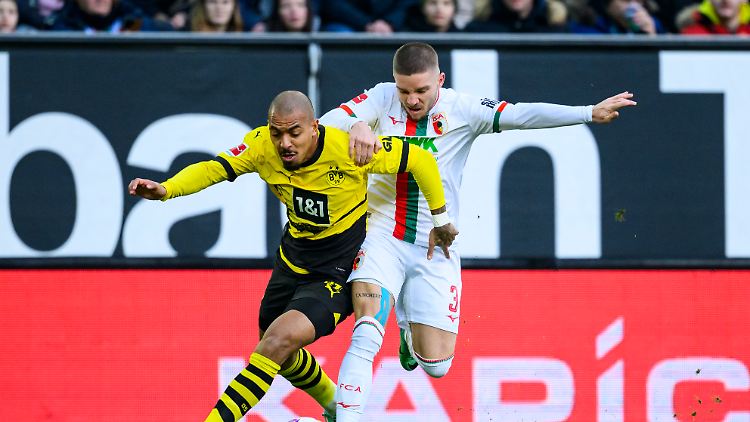 Der FC Augsburg muss selbst noch ein bisschen punkten - und darf auf Borussia Dortmund hoffen.