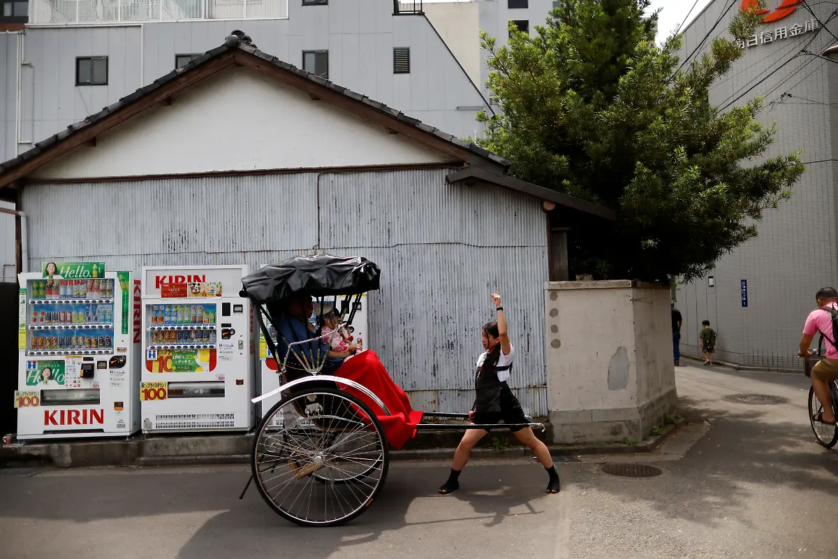2023-09-25T230116Z-98196992-RC2DL1A4785H-RTRMADP-3-JAPAN-WOMEN-RICKSHAW