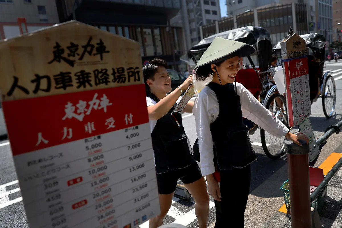 2023-09-25T230126Z-1955437051-RC2R02ARPL1J-RTRMADP-3-JAPAN-WOMEN-RICKSHAW