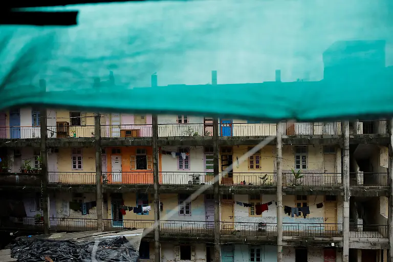 2023-08-03T103444Z-868864986-RC27U1A7BS0E-RTRMADP-3-INDIA-MONSOON-DILAPIDATED-BUILDINGS