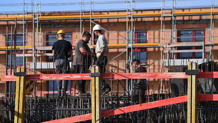 Bauarbeiter in München. Die Stadt hat einen der umkämpftesten Wohnungsmärkte in Deutschland.