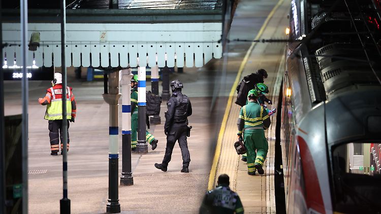 Rettungskräfte arbeiten auf dem Bahnsteig des Bahnhofs Huntingdon.