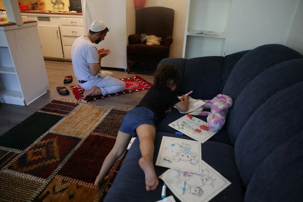 2022-08-11T100048Z-1251591845-RC2YZT9G4ZFN-RTRMADP-3-AFGHANISTAN-CONFLICT-ANNIVERSARY-IMMIGRANT