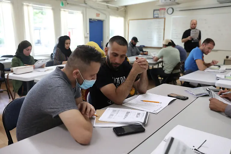 2022-08-11T100040Z-1569497197-RC25NU9M9QDS-RTRMADP-3-AFGHANISTAN-CONFLICT-ANNIVERSARY-IMMIGRANT