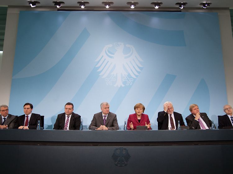 Merkel einigt sich mit den Ministerpräsidenten der Atom-Länder auf die vorübergehende Abschaltung der sieben ältesten deutschen Meiler.
