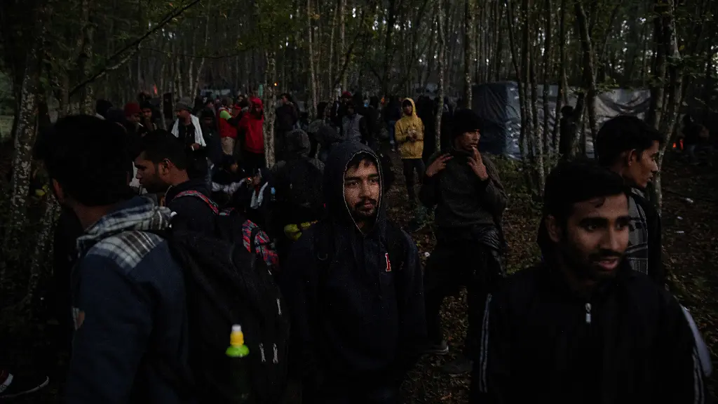 2021-10-07T124612Z-1033333124-RC205Q960AE8-RTRMADP-3-EUROPE-MIGRANTS-COMMISSION