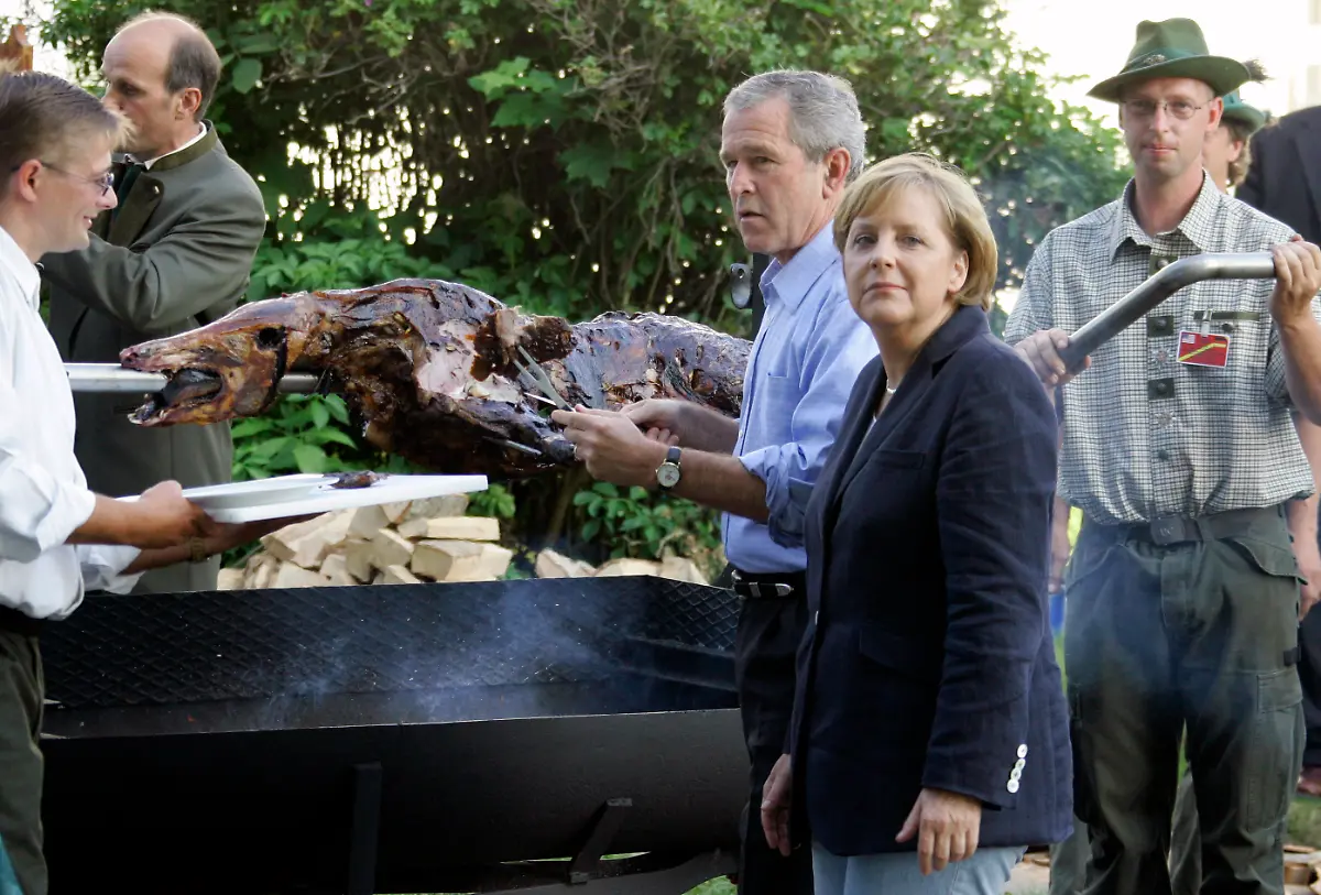 2006-07-13T120000Z-1203768304-GM1DTASBMHAA-RTRMADP-3-GERMANY-BUSH