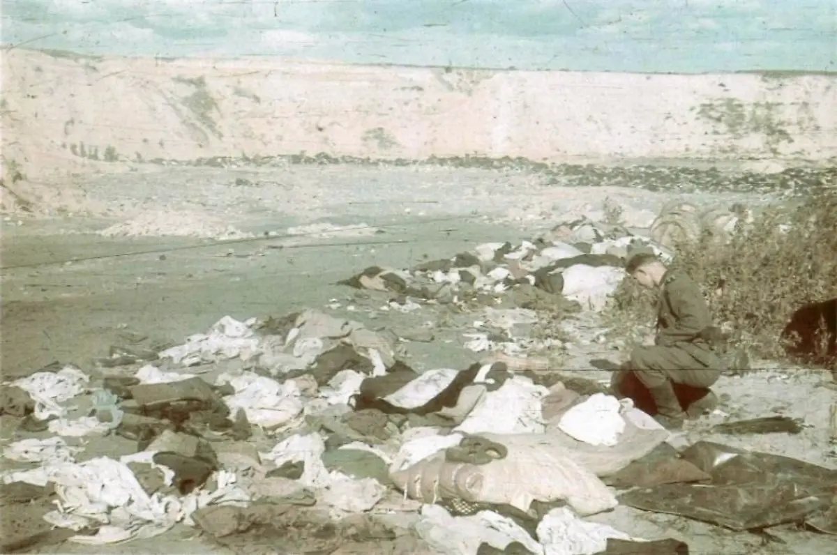 An-SS-man-soldier-digging-in-things-left-from-people-that-were-shot-at-Babi-Yar-in-Kiev-during-German-occupation-in-1941