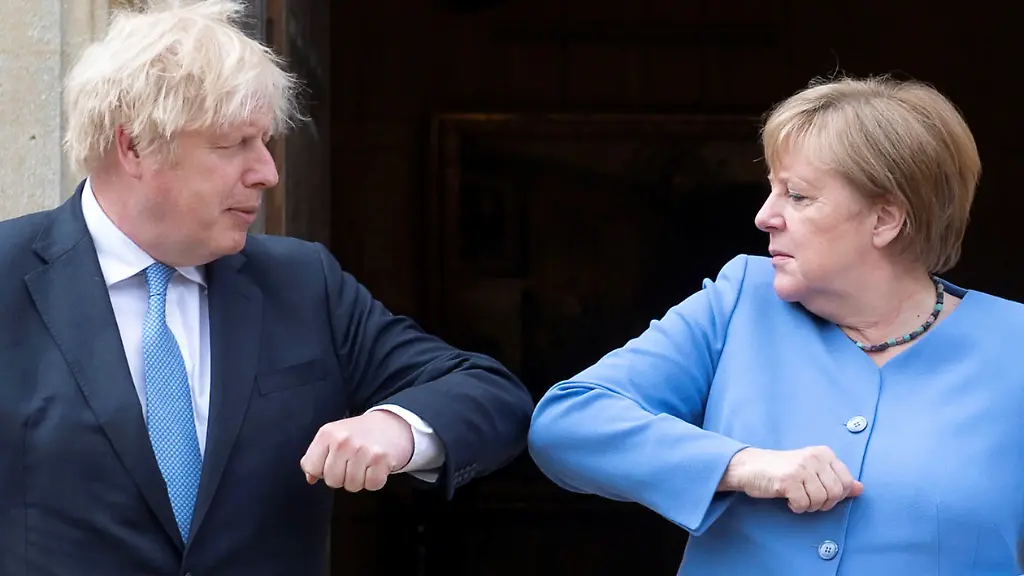 2021-07-02T122356Z-675691598-RC2BCO971CN2-RTRMADP-3-BRITAIN-GERMANY-MERKEL