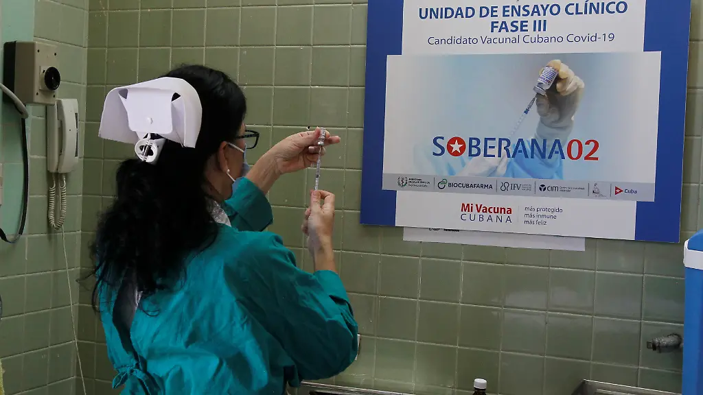 2021-03-31T204038Z-2119697246-RC2KMM9YBEYL-RTRMADP-3-HEALTH-CORONAVIRUS-CUBA