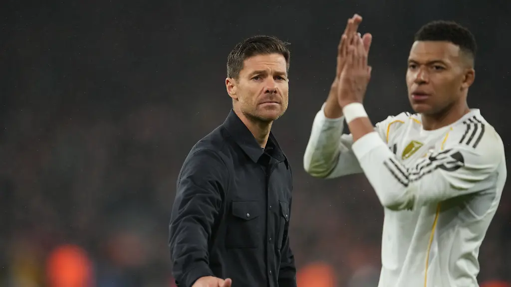 Real-Madrid-s-head-coach-Xabi-Alonso-and-Kylian-Mbappe-walk-off-the-oitch-after-the-Champions-League-soccer-match-between-Liverpool-and-Real-Madrid-in-Liverpool-England-Tuesday-Nov-4-2025-AP-Photo-Jon-Super