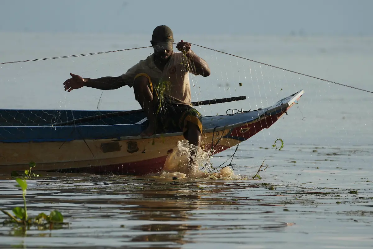 A-fisherman-fishes-in-the-Tonle-Sap-in-Kampong-Chhnang-province-Cambodia-Thursday-Aug