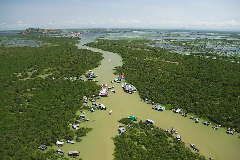 Aerial-View-Of-Floating-Village-Bordering-The-Tonle-Sap-Lake-In-Chong-Kneas-Cambodia