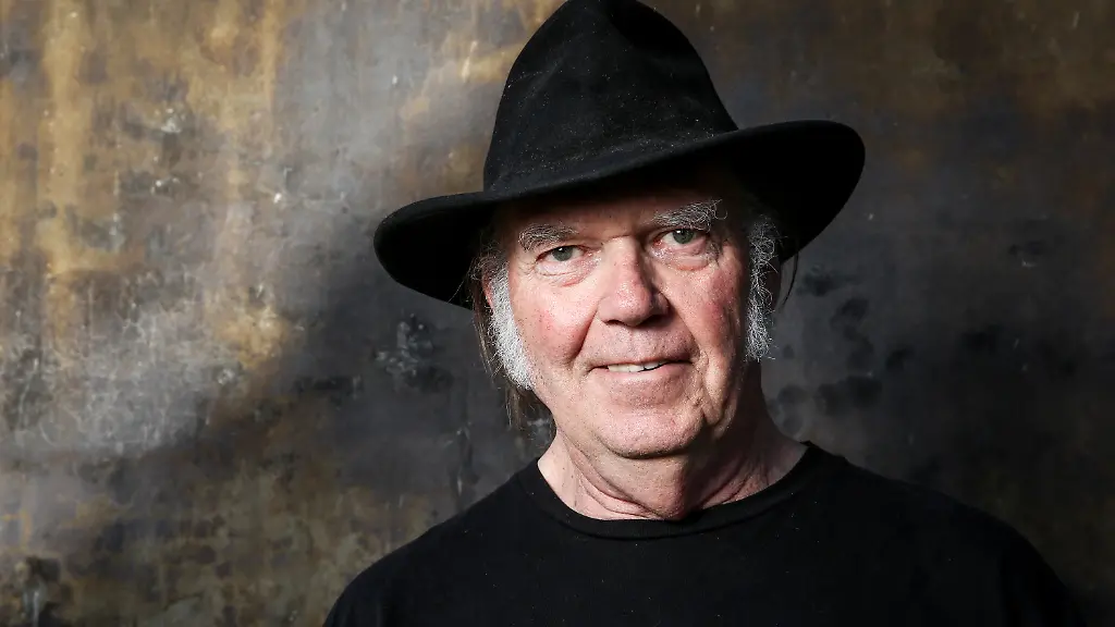 FILE-In-this-May-18-2016-file-photo-Neil-Young-poses-for-a-portrait-in-Calabasas-Calif-Young-will-be-Dan-Rather-s-first-guest-for-the-new-edition-of-Rather-s-series-The-Big-Interview-Young-will-be-featured-on-the-Sept-13-episode-airing-at-8-p-m-EDT-on-AXS-TV