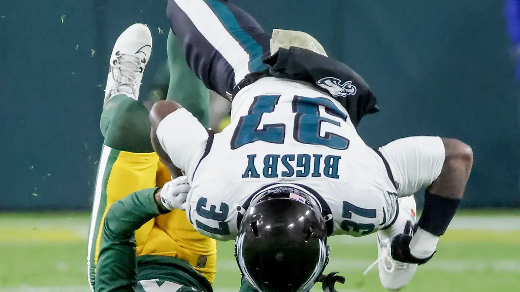 Philadelphia-Eagles-running-back-Tank-Bigsby-flips-over-Green-Bay-Packers-cornerback-Carrington-Valentine-in-the-first-half-of-the-NFL-game-between-the-Philadelphia-Eagles-and-the-Green-Bay-Packers-at-Lambeau-Field-in-Green-Bay-Wisconsin-on-Monday-November-10-2025