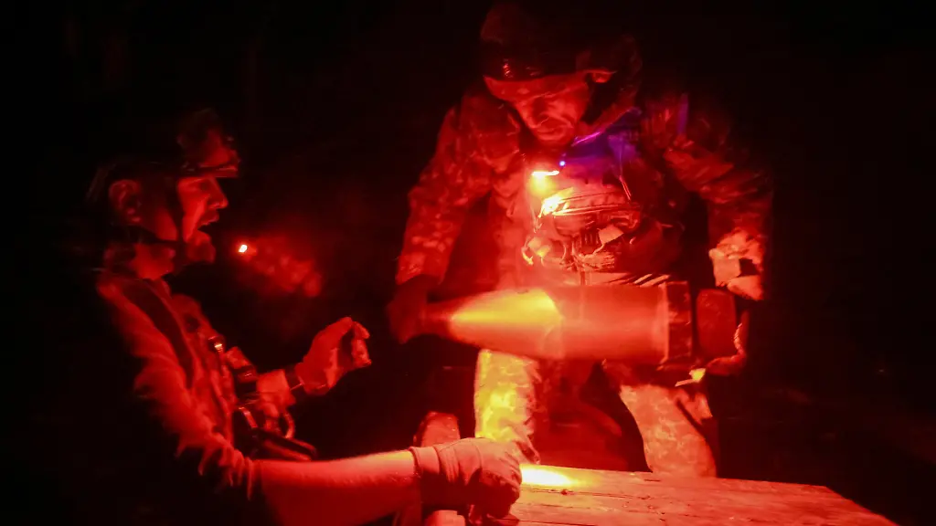 Artillerymen-of-the-152nd-Separate-Jaeger-Brigade-unload-shells-for-an-M114-self-propelled-howitzer-amid-Russia-s-attack-on-Ukraine-near-the-frontline-town-of-Pokrovsk-in-Donetsk-region-Ukraine-October-14-2025