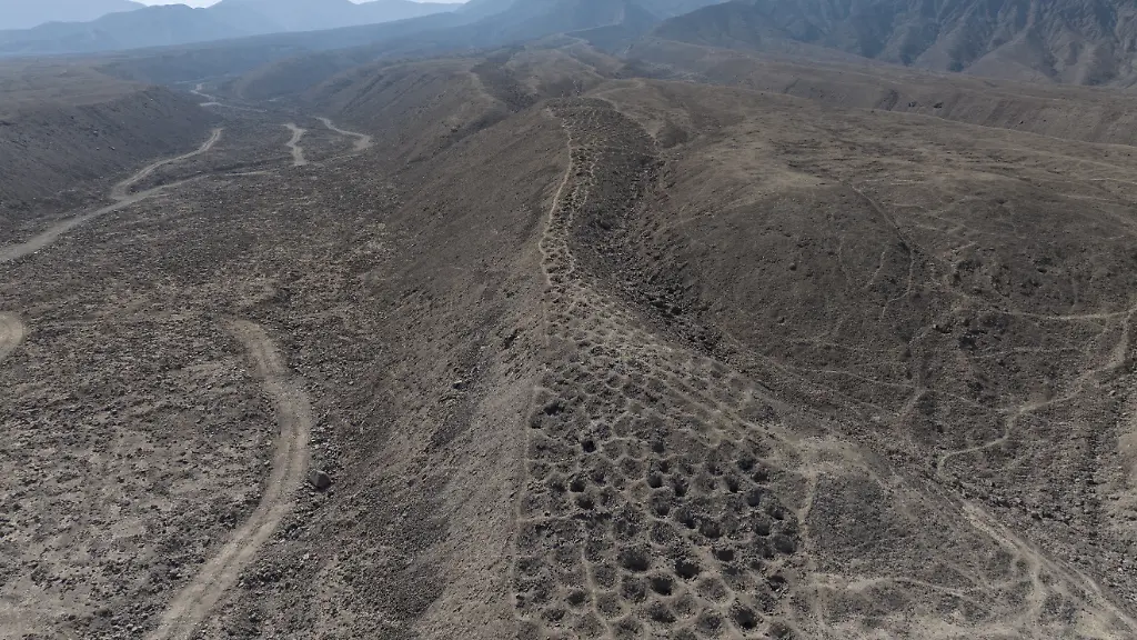 Aerial-photography-and-microscopic-plant-analysis-have-revealed-new-clues-that-could-resolve-the-mystery-of-one-of-Perus-most-enigmatic-monuments-Monte-Sierpe-or-the-Band-of-Holes-They-believe-they-have-found-evidence-suggesting-it-may-once-have-served-as-both-a-trading-hub-and-an-Inca-accounting-centre