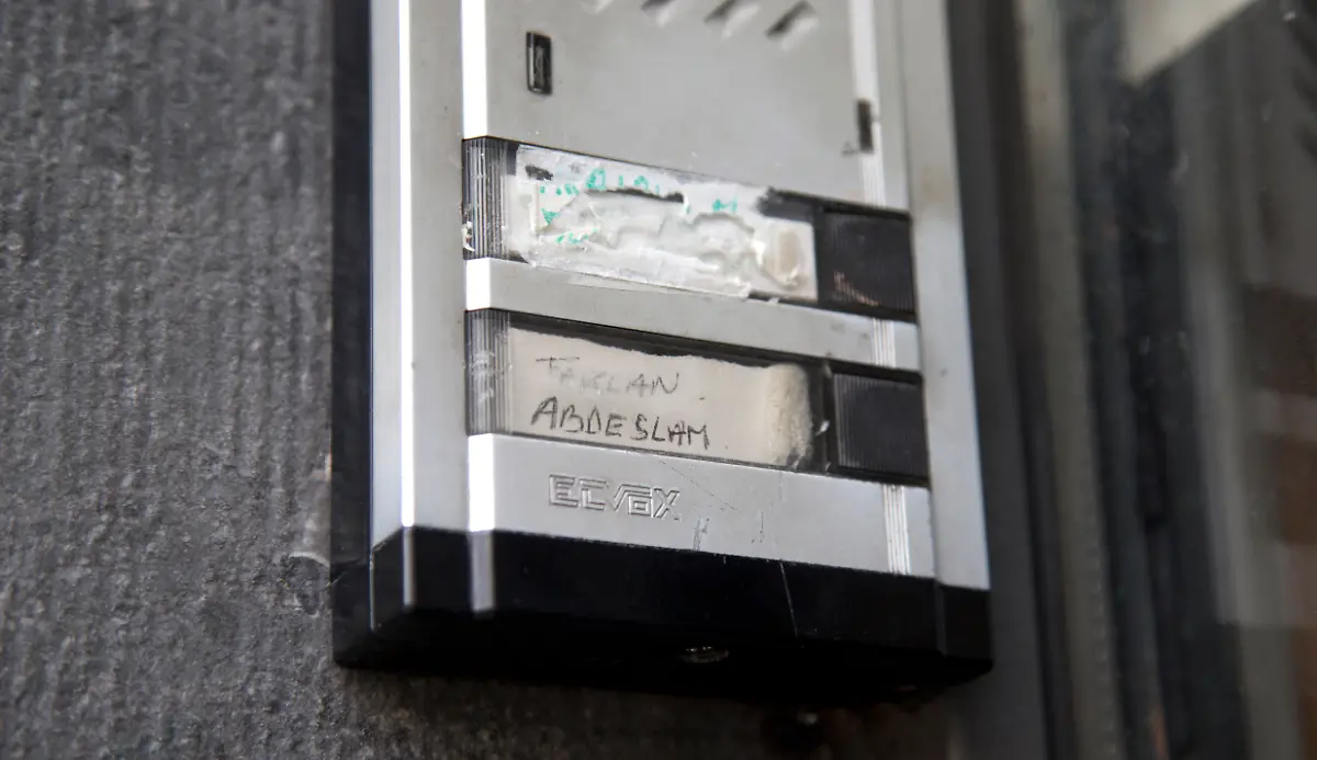 The-Abdeslam-name-is-shown-on-the-doorbell-on-the-house-of-the-family-of-Belgian-militants-Brahim-and-Salah-Abdeslam-in-Molenbeek-Belgium-on-Wednesday-Nov-18-2015-After-a-Wednesday-morning-raid-in-the-Paris-suburb-of-Saint-Denis-authorities-could-not-immediately-confirm-whether-Abdelhamid-Abaaoud-a-Belgian-Islamic-State-militant-was-killed-or-arrested-Both-Abaaoud-and-the-Abdeslam-brothers-grew-up-in-the-same-neighborhood-of-Molenbeek