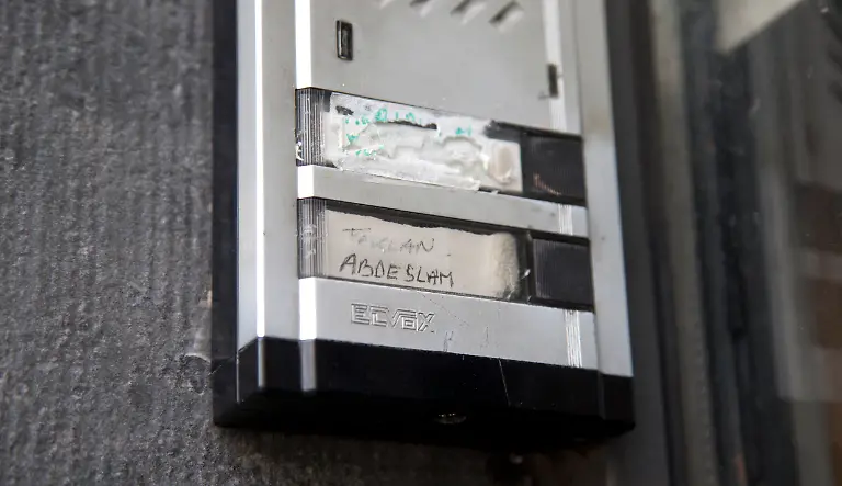 The-Abdeslam-name-is-shown-on-the-doorbell-on-the-house-of-the-family-of-Belgian-militants-Brahim-and-Salah-Abdeslam-in-Molenbeek-Belgium-on-Wednesday-Nov-18-2015-After-a-Wednesday-morning-raid-in-the-Paris-suburb-of-Saint-Denis-authorities-could-not-immediately-confirm-whether-Abdelhamid-Abaaoud-a-Belgian-Islamic-State-militant-was-killed-or-arrested-Both-Abaaoud-and-the-Abdeslam-brothers-grew-up-in-the-same-neighborhood-of-Molenbeek