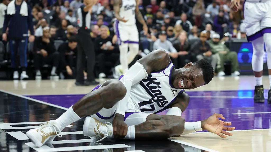 Sacramento-Kings-guard-Dennis-Schroeder-grabs-his-ankle-after-going-up-for-a-layup-during-the-first-half-of-an-NBA-basketball-game-against-the-Minnesota-Timberwolves-Sunday-Nov-9-2025-in-Sacramento-Calif