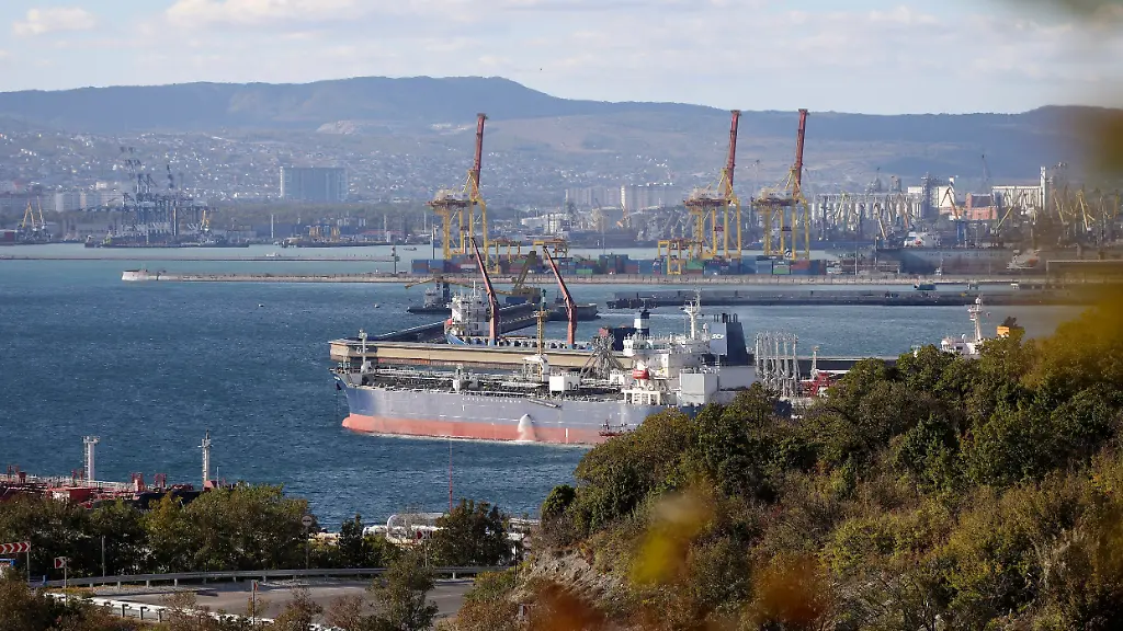 FILE-An-oil-tanker-is-moored-at-the-Sheskharis-complex-part-of-Chernomortransneft-JSC-a-subsidiary-of-Transneft-PJSC-in-Novorossiysk-Russia-on-Oct-11-2022-one-of-the-largest-facilities-for-oil-and-petroleum-products-in-southern-Russia-Oil-prices-have-risen-meaning-drivers-are-paying-more-for-gasoline-and-truckers-and-farmers-more-for-diesel-The-increase-also-is-complicating-the-global-fight-against-inflation-and-feeding-Russia-s-war-chest-to-boot